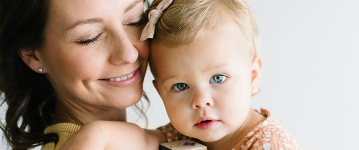 18 month sleep regression Mom holding toddler