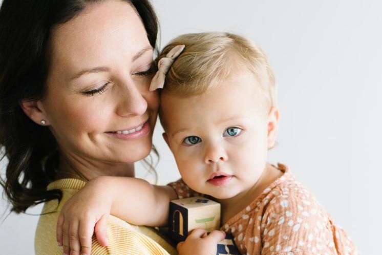 18 month sleep regression Mom holding toddler