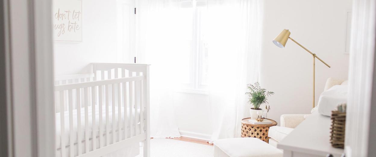 bright white airy nursery with open windows