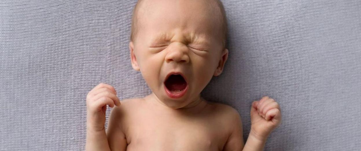 baby yawning after being up all night with day-night confusion
