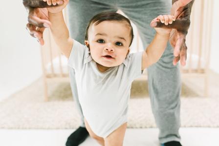 baby walking with Dad during awake time between naps